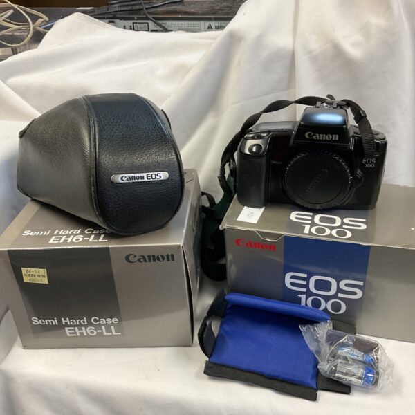 Canon EOS-100 camera with EH6-LL case, vintage film photography.