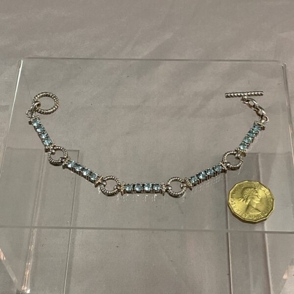 Elegant 925 silver bracelet with vibrant blue stones.