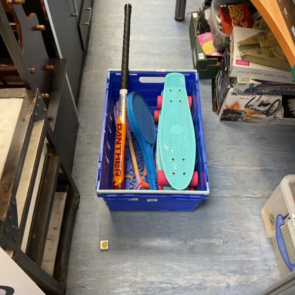 Blue skateboards and hockey stick in outdoor toys bundle.