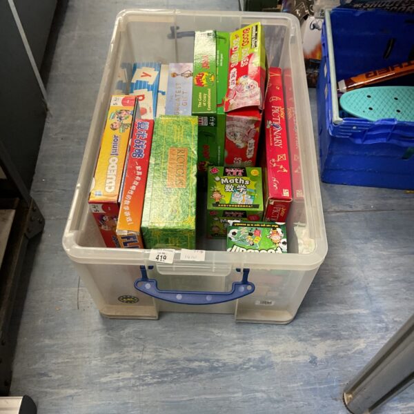 Clear plastic box filled with childrens education and board games.