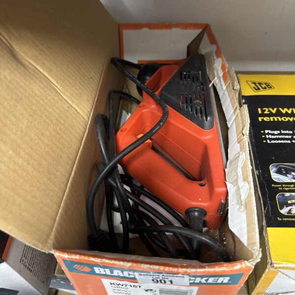Close-up of a used Black & Decker electric wood planer.
