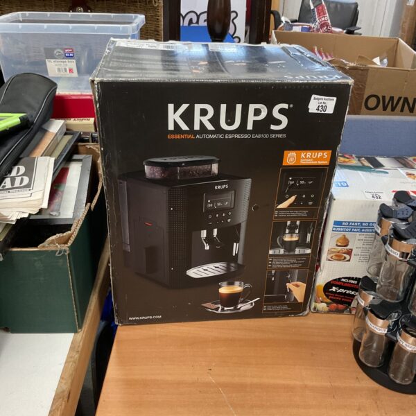 Krups EA8100 automatic espresso machine in a kitchen setting.
