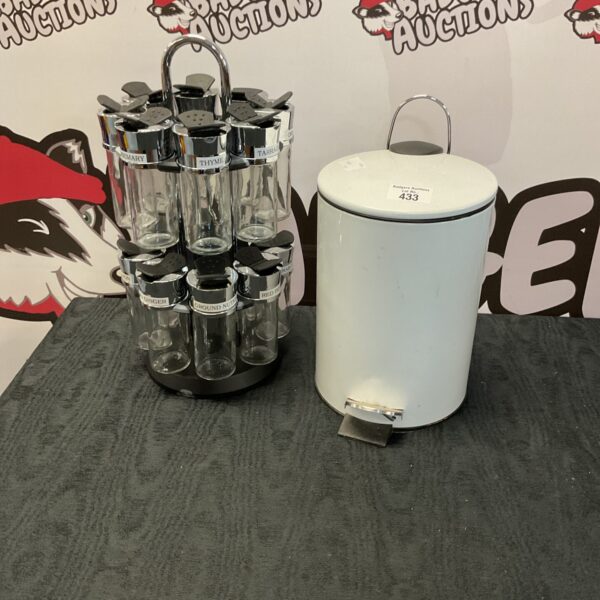 Vintage spice rack and metal bin set for kitchen storage.