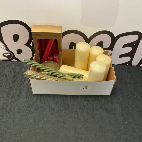 Assorted candles in various colours and sizes, a decorative collection.