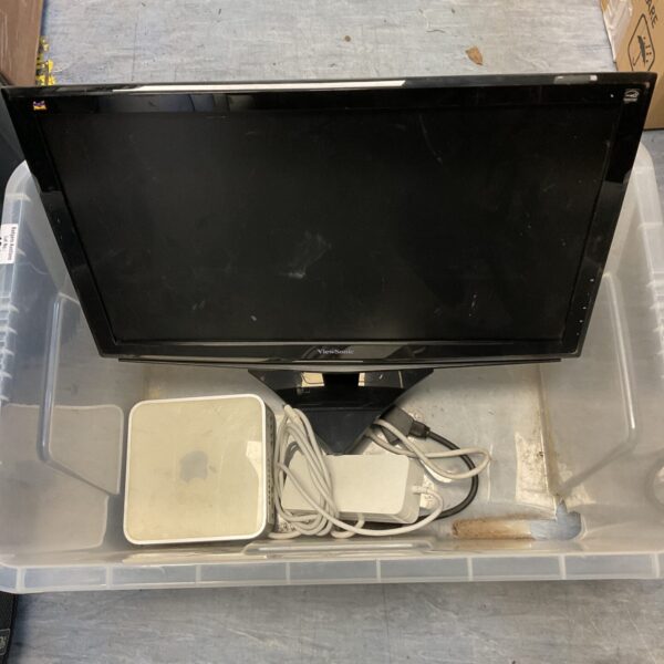 Apple Mac Mini computer with ViewSonic monitor, vintage desktop setup.