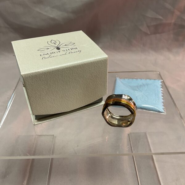 Silver spinner ring with energy stone, size U.