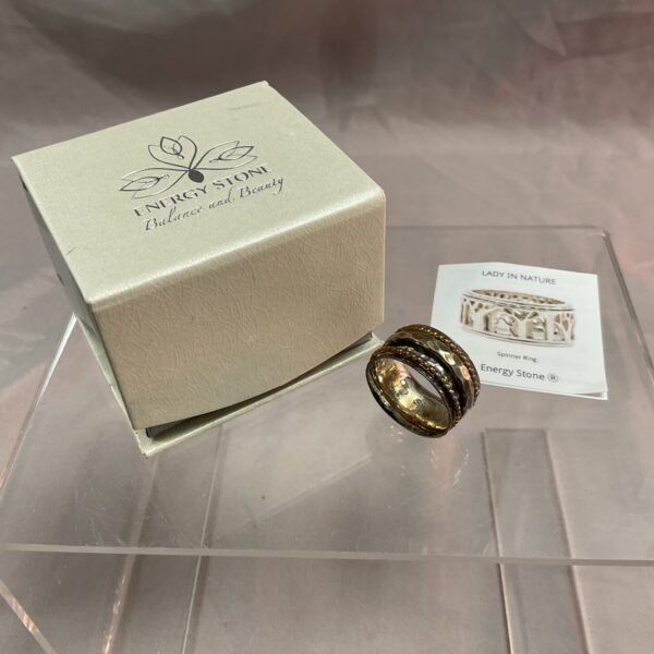 Silver spinner ring with energy stone, size Q.