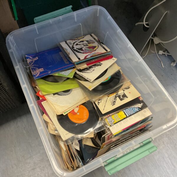 Large lot of vintage 7 inch vinyl records for collectors.