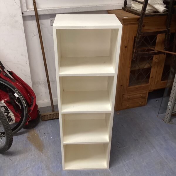 White painted three-shelf bookcase for home storage and display.