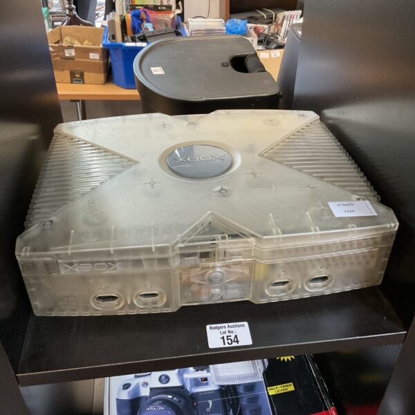 Front view of the clear Microsoft Xbox Crystal console.