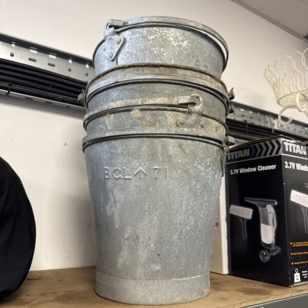 Vintage galvanised metal bucket with crows foot marking.