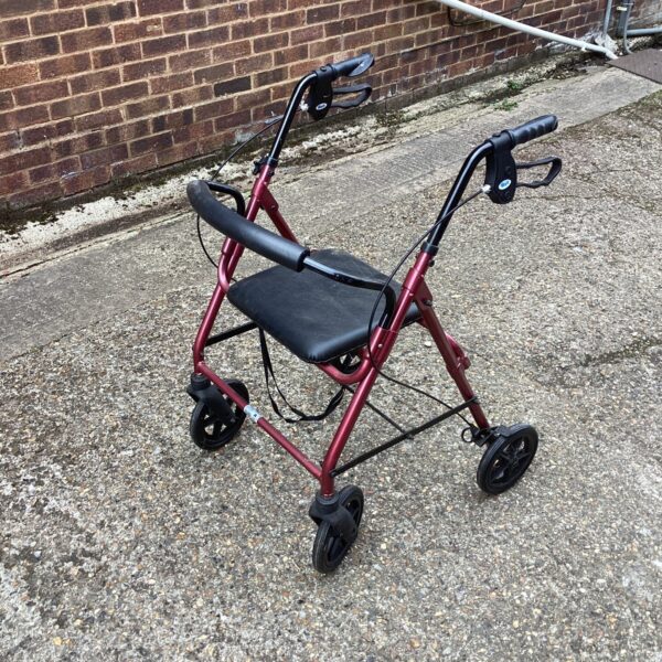 Red Days Healthcare walking trolley with a seat and basket.