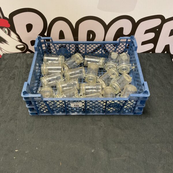 Tray of clear Brica kitchen jars for food storage.