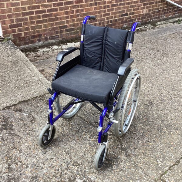 Dark coloured manual wheelchair, mobility aid for sale.