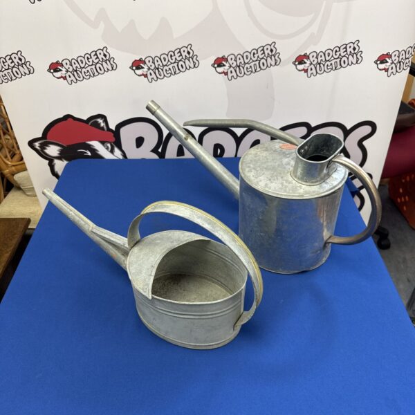 Vintage galvanised watering cans for garden use and display.