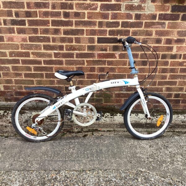 White folding bicycle offered for repair, ideal for city commuting.