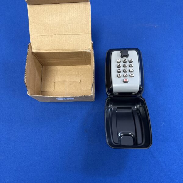 New wall key safe with combination lock in original packaging.