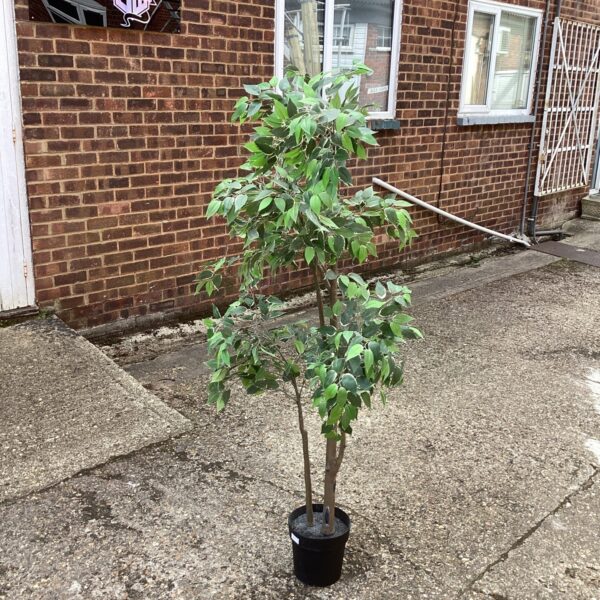 Realistic artificial tree in a black pot for indoor home decor.