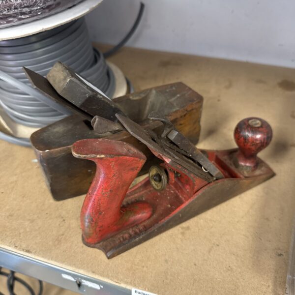 Vintage wood planes including an Acorn plane for woodworking.