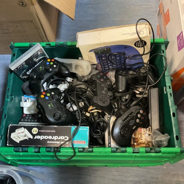 Mixed lot of gaming controllers for Xbox and PlayStation consoles.
