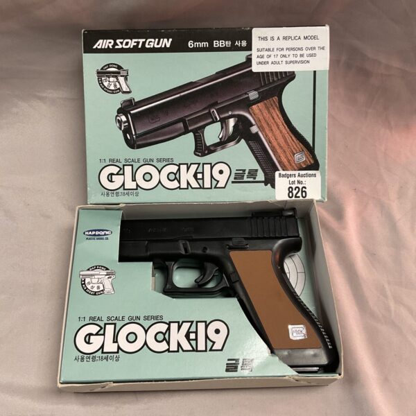 Black airsoft Glock 19 replica pistol for recreational use.