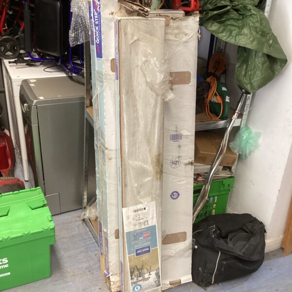Five packs of unopened Quick Step grey laminated flooring panels.