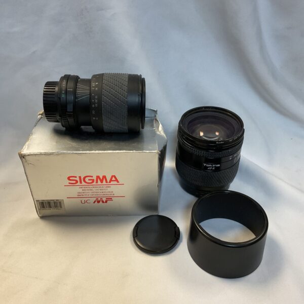 Vintage Tokina AT-X camera lens with zoom functionality.