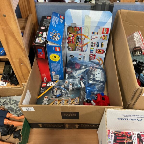 Mixed Lego lot with sets and loose parts for building.