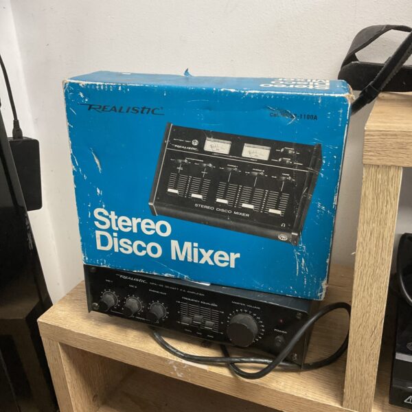 Vintage Realistic MPA-45 stereo mixer with controls visible.