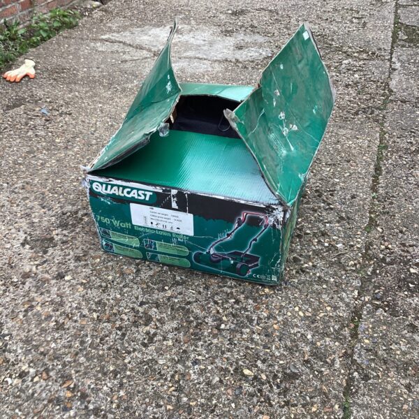 Qualcast electric lawn rake still in its original packaging.