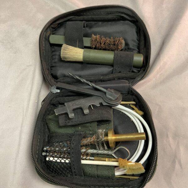 Open British Army SA80 cleaning kit showing contents.