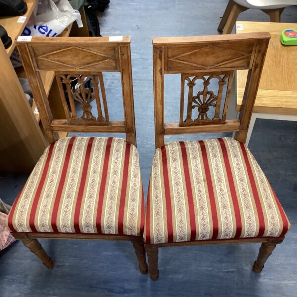 Pair of antique Victorian mahogany chairs with patterned upholstery.