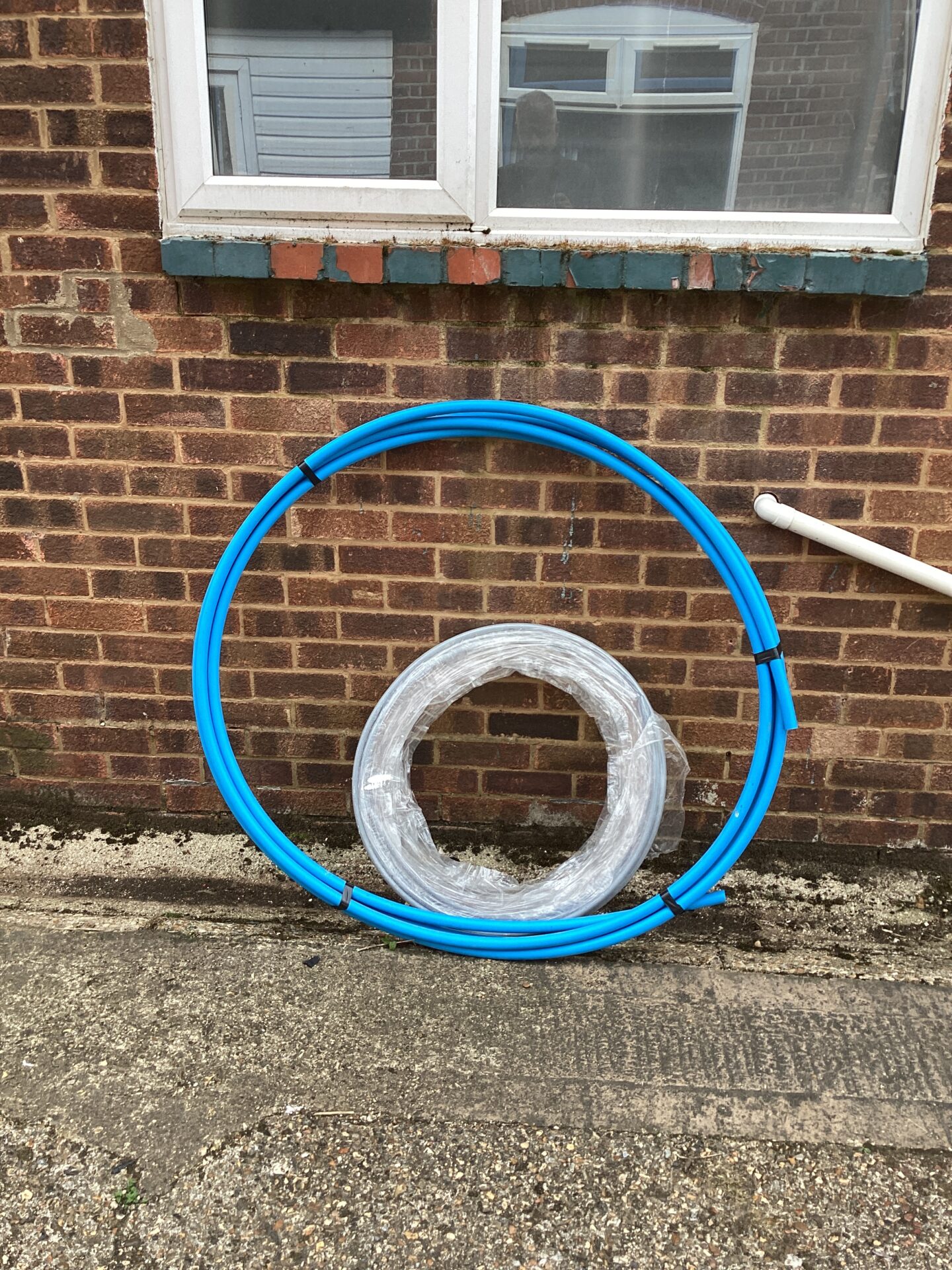 1073 Two rolls of plastic water pipe