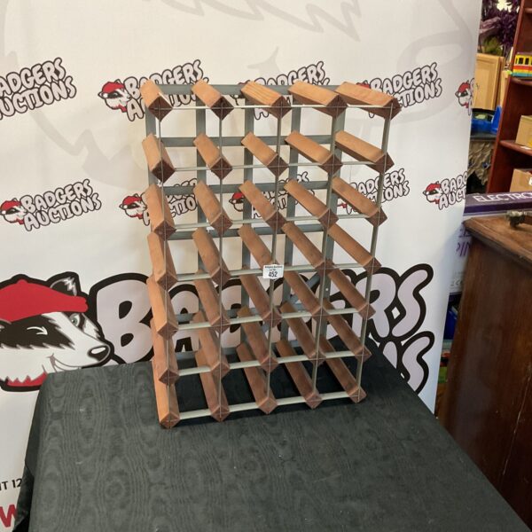 Metal Farrow and Jackson wine rack for storing wine bottles.