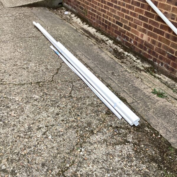 White plastic waste pipe sections for plumbing projects.