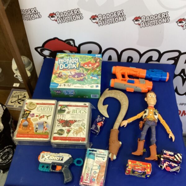 Mixed toy lot including Monkey Dunk game and figurine.