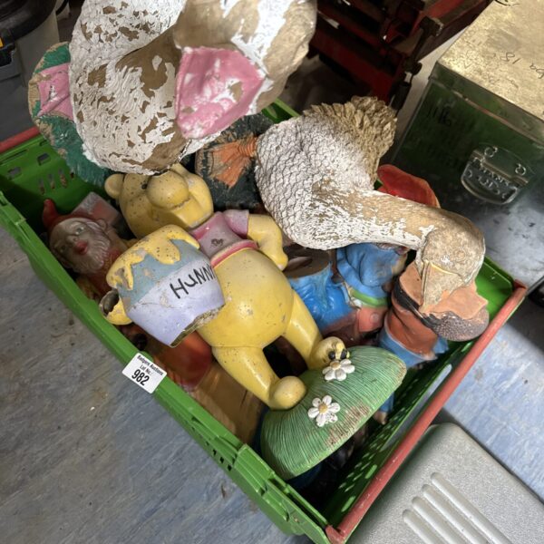 Vintage Winnie the Pooh garden ornament in a lot of decor.