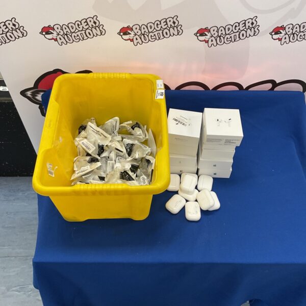 Mixed lot of earbuds and replacement earbud plugs on a table.