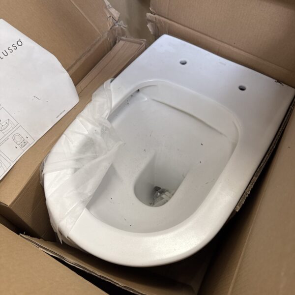 Lusso toilet pan inside cardboard box, new bathroom fixture.