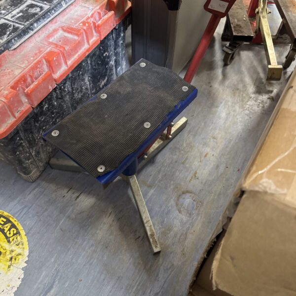 Used motorcycle lift stand for bike maintenance and repair.