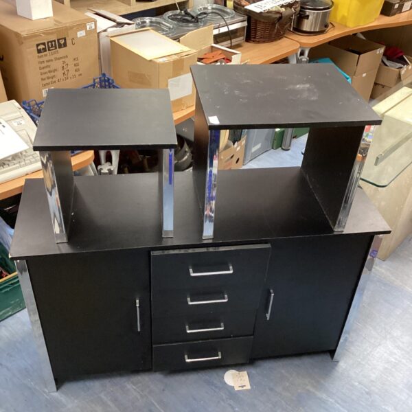 Black dining cabinet with nest of tables for modern dining rooms.