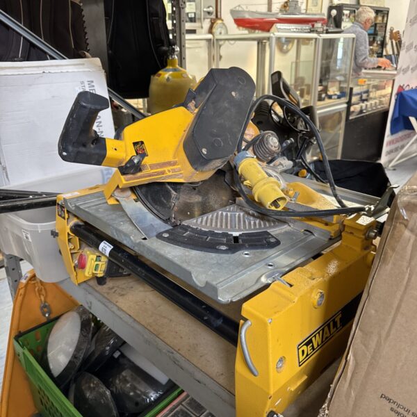 Used Dewalt mitre saw with box and attachments.