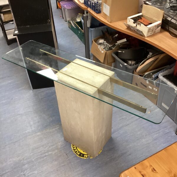 Square glass top pedestal table with marble effect base.