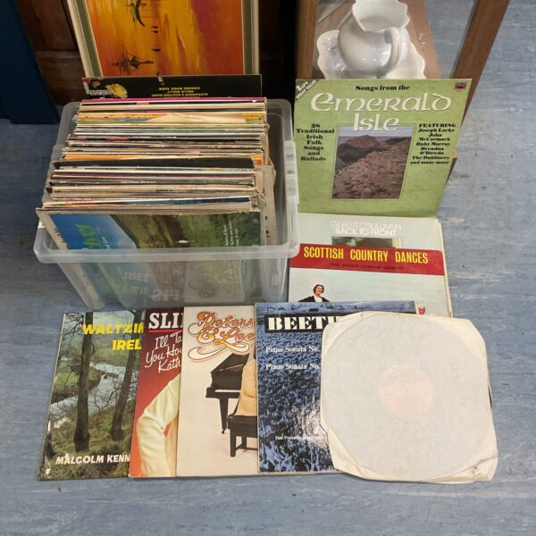 Assortment of vintage vinyl records in a mixed lot.