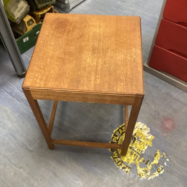 Small vintage wooden side table with a square top.