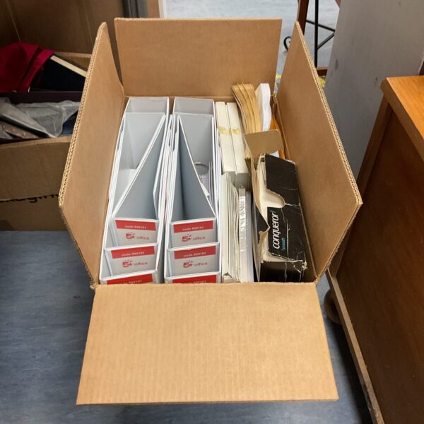 Assorted office supplies lot including ring binders and envelopes.
