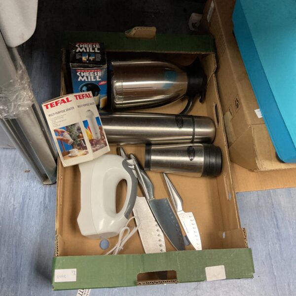 Kitchen appliance bundle including mixer, grater, and thermoses.