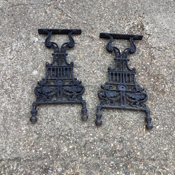 Ornate wrought iron table legs set for garden furniture.