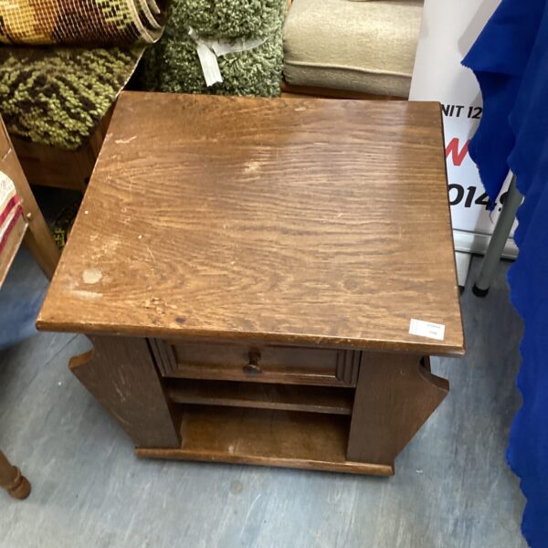 Vintage mahogany side table with magazine racks and drawer.