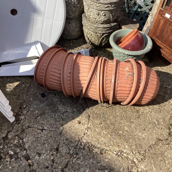 Lot of plastic hanging baskets for garden plants and flowers.